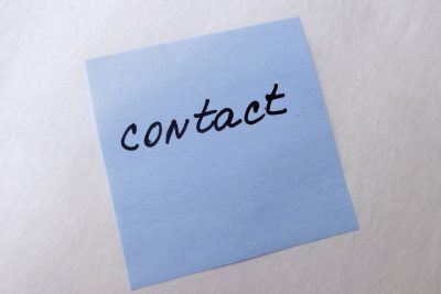 Post-it note with "Contact" written on it.